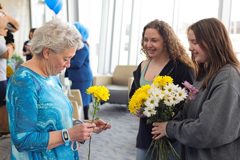 Students handing out flowers in the University Center